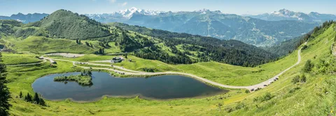 Lac de Joux-Plane and its mountain pastures in Verchaix