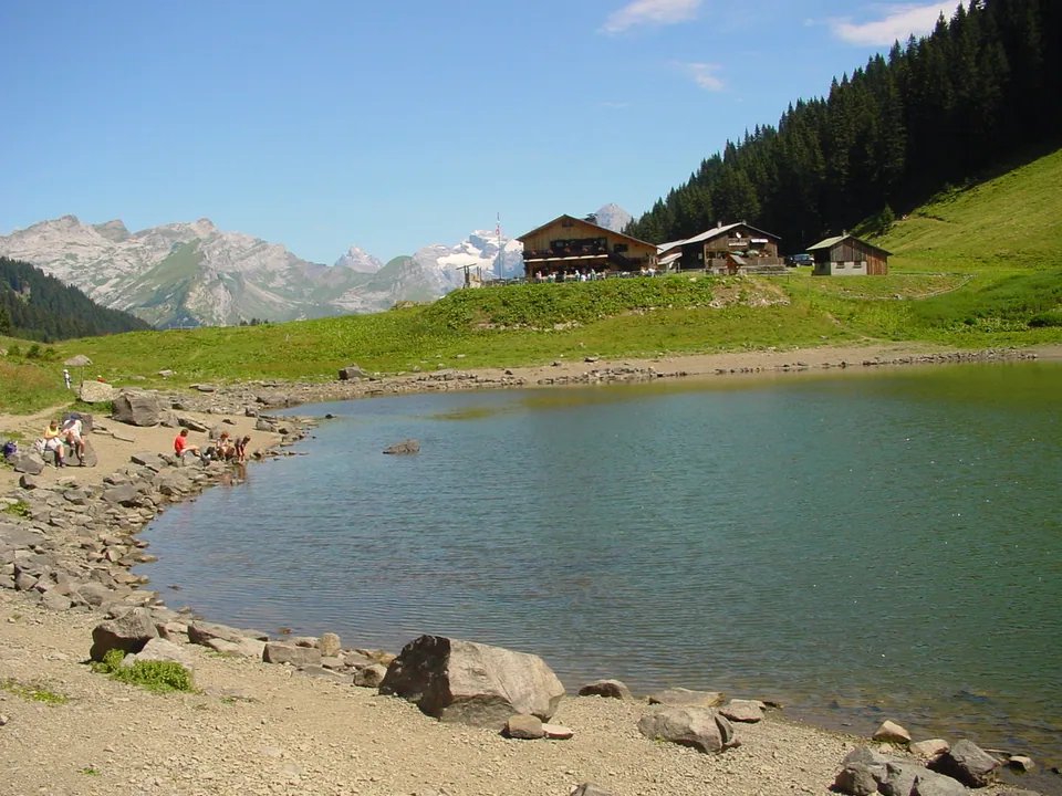 Lac de Gers and its Alpine chalets in summer
